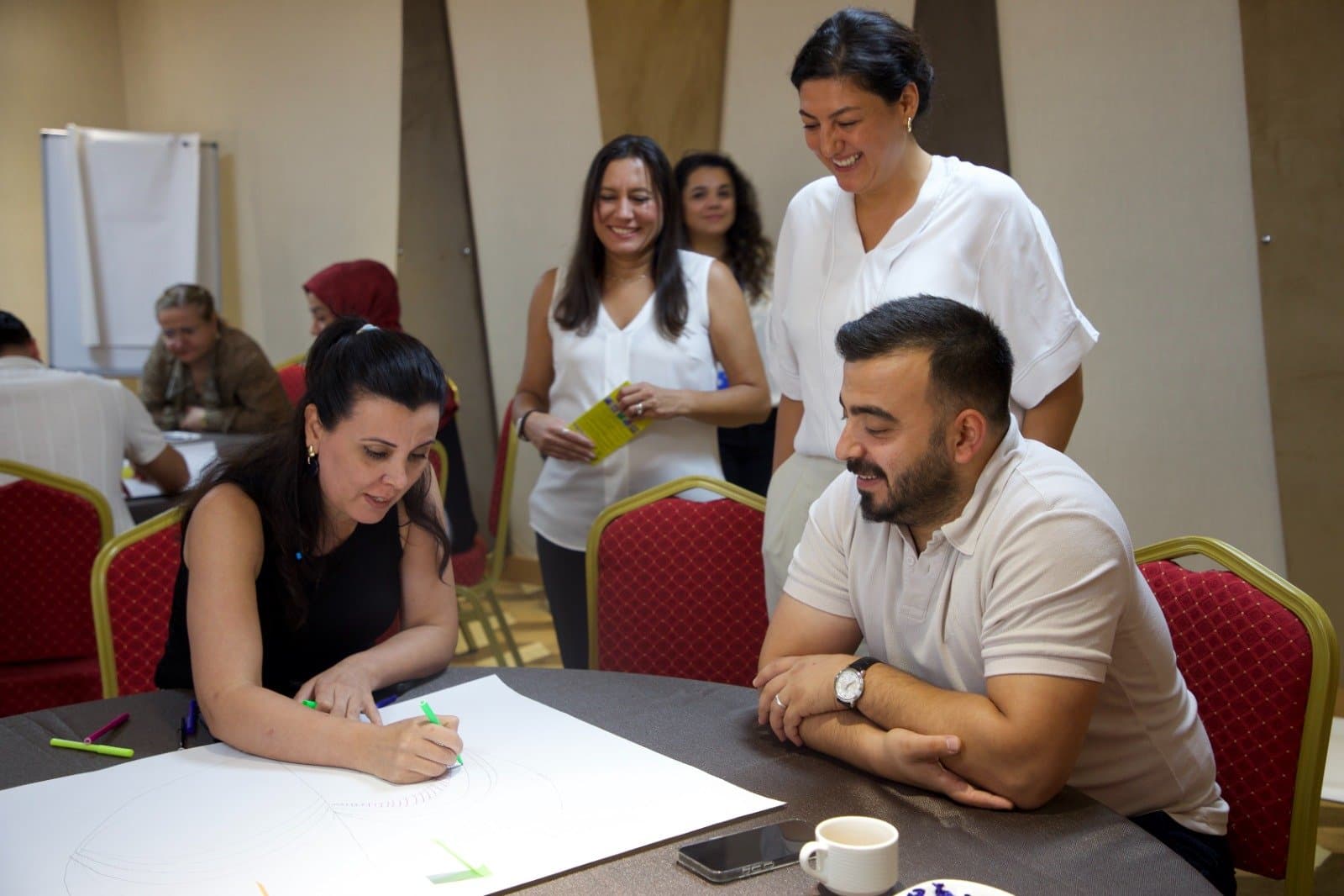 Programme participants collaborating during a workshop session